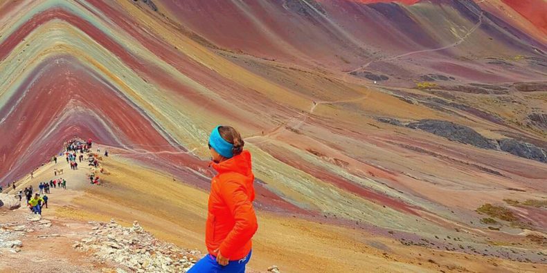 woman visiting rainbow mountain alone