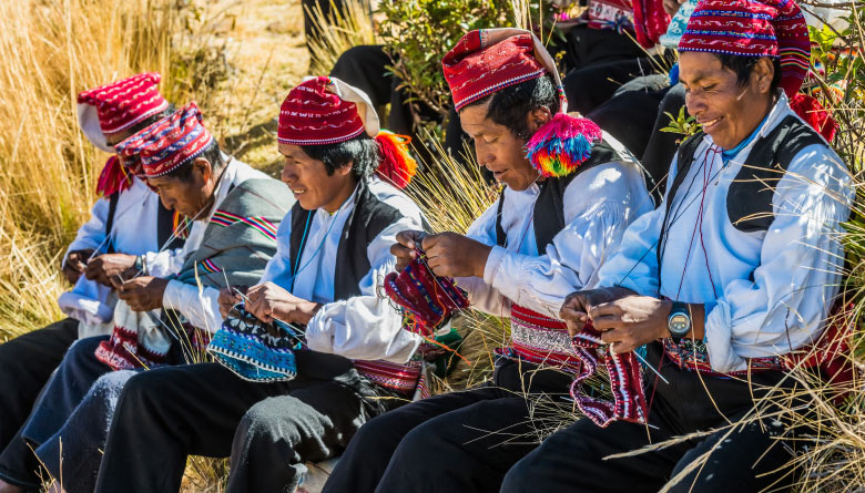 Local men weaving in Taquile Island - Lake Titicaca facts
